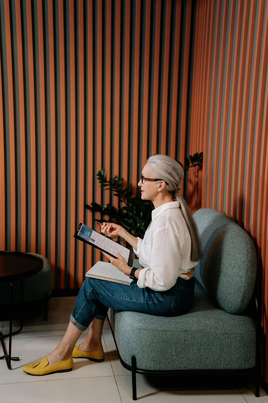 Skills-Based Hiring Manager Sitting on Retro Couch